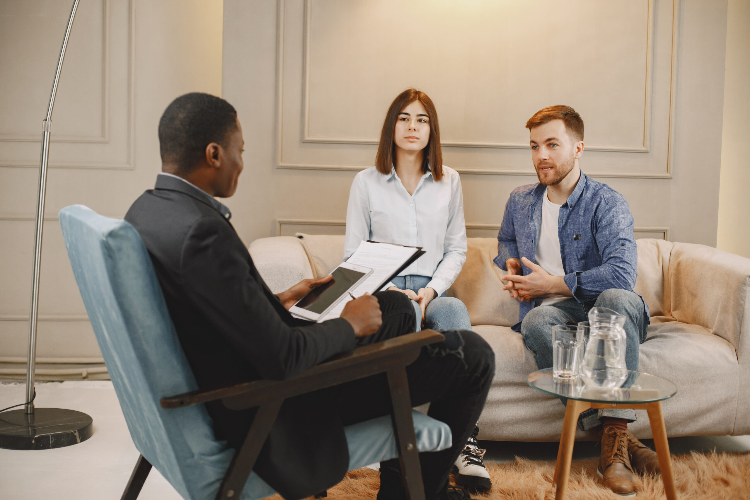 couple at pshycologist appointment sitting in modern office